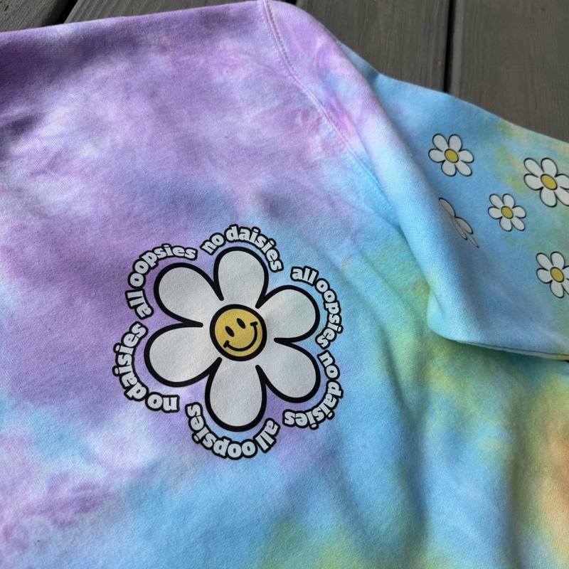 All oopsies no daisies. Whimsy, tiedye. Arm designs. Crewneck