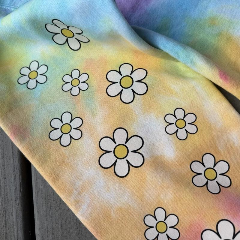 All oopsies no daisies. Whimsy, tiedye. Arm designs. Crewneck