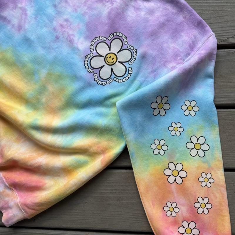 All oopsies no daisies. Whimsy, tiedye. Arm designs. Crewneck